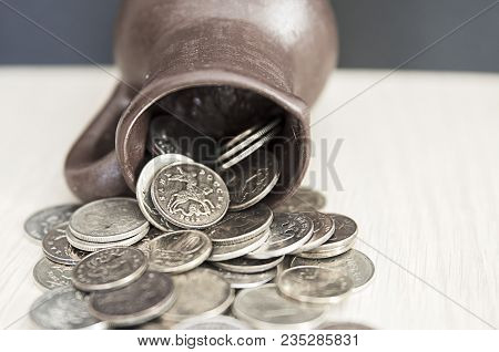 Ancient Jug With Coins. Old Coins In A Pot. Savings