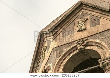 Relief Figures Of Saints Under The Stone Octagonal Roof Of The Bell Tower Of The Church Of St. Mesro