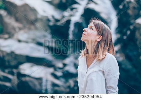 Beautiful Young Woman Relaxing In The Nauture On The Spring Day