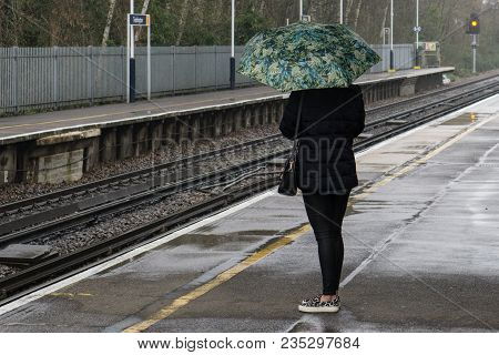 Waiting For A Late Train On A Rainy Day