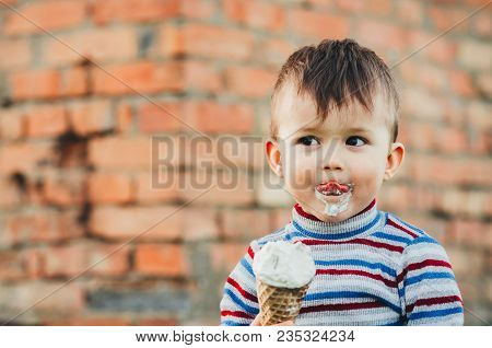 Little Cute Boy Boy Boy Three Years Eating Ice Cream Very Appetizing On Brick Wall Background