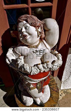 Jerome, Arizona, January 30, 2018: The Statue Of A Lady Is In Front Of The The Bordello Of Jerome, A