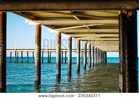 Under A Pier, Clear Turquoise Water Of The Caribbean Sea.