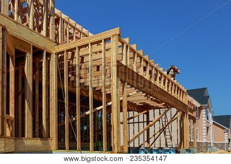 Wood Building Frame At Multi-family Housing Construction Site Post And Beam Construction