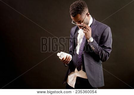 Close Up Portrait Of Black Guy In Fashionable Suit With Mineral Water After Crapulence Hangover Isol