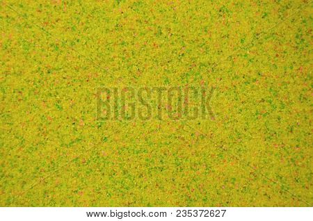 Texture Of A Colored Granular Sand Close Up. Yellow Grains
