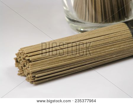 Bundle Of Japanese Soba Noodles Made Of Buckwheat Flour On A Light Background, Uncooked