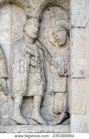 MODENA, ITALY - JUNE 04: Plate with stories from Genesis: Story about Abel and Cain, God the Father reproaches Cain, relief by Wiligelmo, Modena Cathedral, Italy on June 04, 2017.