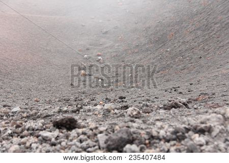 The Etna Volcano. Black Volcanic Earth, Volcanic Lava And Stones. Dense Fog On Mount Etna. Place For