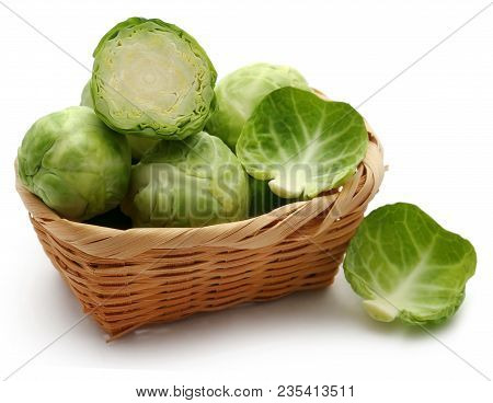 Rosenkohl Or Brussels Sprout In A Basket Isolated Over White Background
