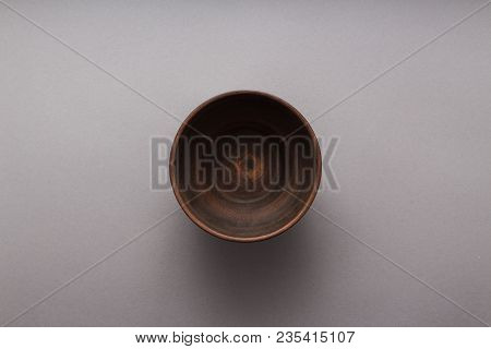Empty Brown Plate On Grey Background, Top View, Flat Lay