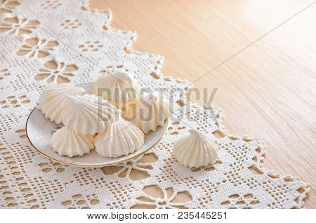 White Meringue On A Lacy Cloth. Still Life.
