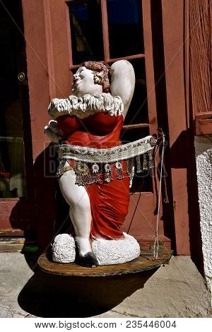 Jerome, Arizona, January 30, 2018: The Statue Of A Lady Is In Front Of The The Bordello Of Jerome, A