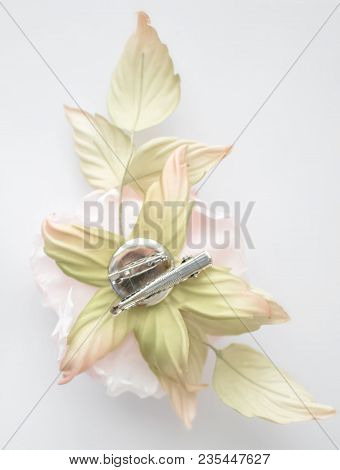 Back Side Of Hand Made Flower Rose On White Blurred Background With Pin For Fastening. Vintage Retro