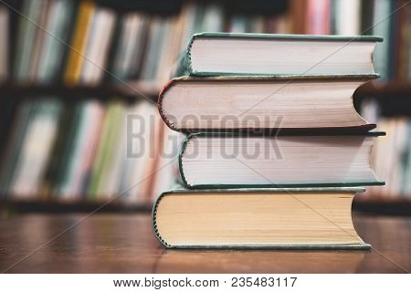 Education Learning Concept, Books On The Desk In The Auditorium, Book Stack On Wood Desk And Blurred