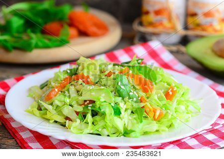 Simple сabbage Salad With Avocado. Home Cabbage Salad Avocado, Dried Apricots, Arugula And Sesame On