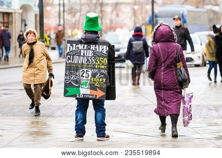 Moscow, Russia - April, 2, 2018: promoter stands with an  advertisement in Mosocw