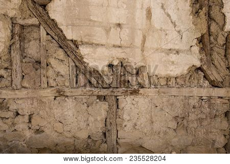 Stone Wall With Stone, Wood And Mud Background
Rustic Wall In A Old Construction With Stone, Wood An