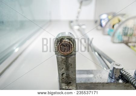 Hard Water Deposit And Rust On Shower Tap