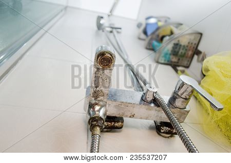 Hard Water Deposit And Rust On Shower Tap