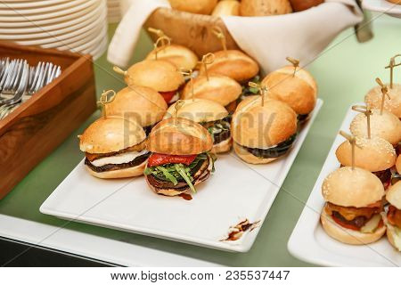 Close Up Of Mini Hamburgers At Catering Event.