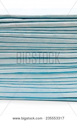 Stack  Of Disposable Bed Pads Isolated On White