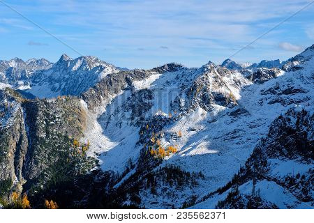 Mountain Landscape With Snow And Yellow Trees. Cascade Mountains. North Cascades National Park. Seat