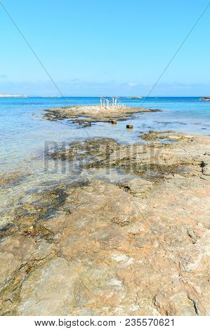 Beautiful View Of A Blue Water Beach On The Island Of Formentera, In The Es Pujols Beach