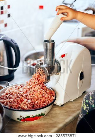 Twist The Meat In A Meat Grinder