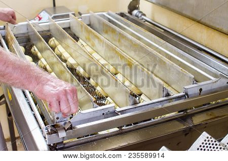 Preparation Of Donuts. Roasting In Boiling Oil. Cookng, Fried.