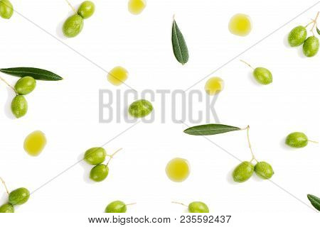 Top View Of Fresh Green Olive Fruits With Leaves And Puddles Of Olive Oil Isolated On White Backgrou