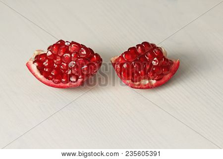 Big Ripe Red Granets Or Garnets. Fruits Of Red Ripe Pomegranate On The White Background. Vegetarian 