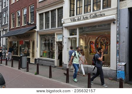 Amsterdam, Netherlands - July 10, 2017: People Walk Along Nieuwe Spiegelstraat, Antique Shopping Str