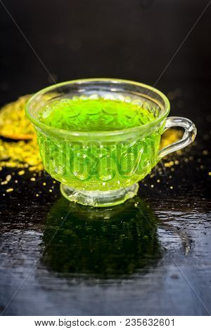 Closes Up Of Essential Tea Of Raw Fresh Fennel Seeds With Raw Fennel Seeds In A Transparent Cup On W