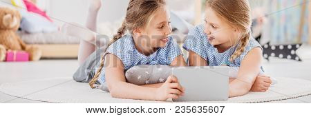 Friends Playing Games On Tablet