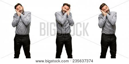 Middle age man, with beard and bow tie tired and bored, tired because of a long day overworking