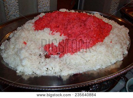 Steamed Rice
Steamed White And Red Rice Served In A Big Metal Platter