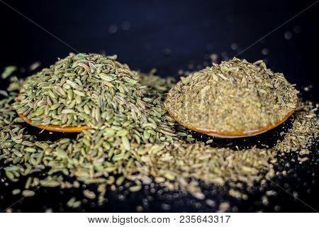 Close Up Of Raw Dried Fennel Seeds Or Variyali Or Foeniculum Vulgare On A Wooden Surface With Its Po