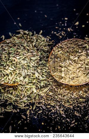 Close Up Of Raw Dried Fennel Seeds Or Variyali Or Foeniculum Vulgare On A Wooden Surface With Its Po