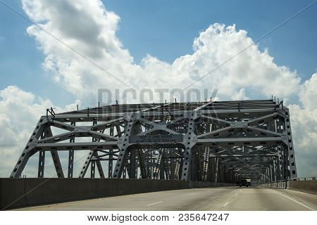 Driving Across The Huey P. Long Bridge Over The Missssippi River In Louisiana, Usa; Concept For Road