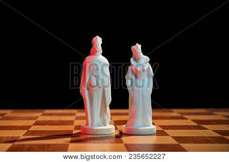 Chess Photographed On A Chessboard And Dark Background