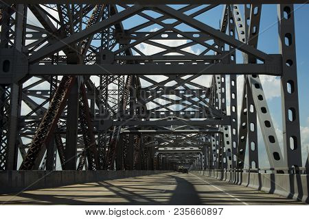 Driving Across The Huey P. Long Bridge Over The Missssippi River In Louisiana, Usa; Concept For Road