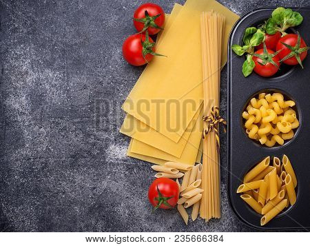 Various Type Of Pasta And Cherry Tomato. Top View