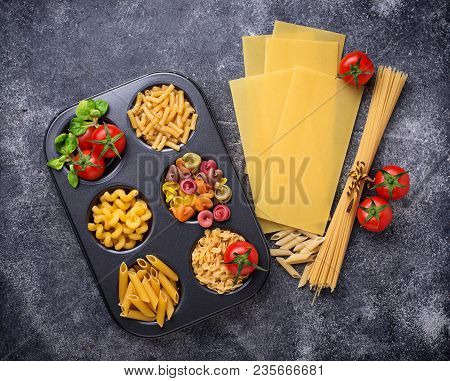 Various Type Of Pasta And Cherry Tomato. Top View