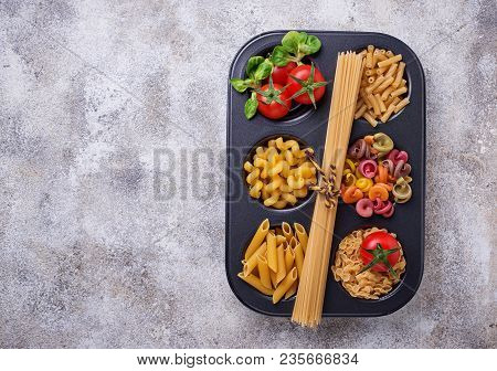 Various Type Of Pasta And Cherry Tomato. Top View