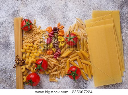 Various Type Of Pasta And Cherry Tomato. Top View