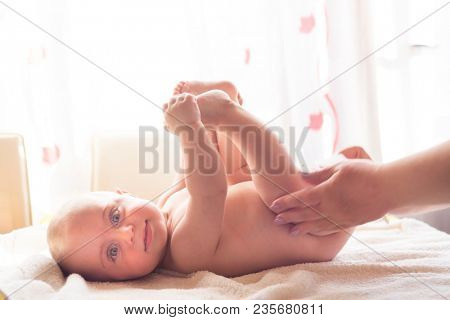 Hygiene - young momy wiping the baby skin with wet wipes. Cleaning wipe, pure, clean