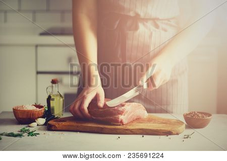Wooman Hands Cutting Beef Meat On Wooden Chopping Board, Rosemary, Oil, Salt, Pepper. Girk Cooking P