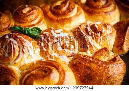 Sweet Buns With Jam And Cream On A Baking Sheet