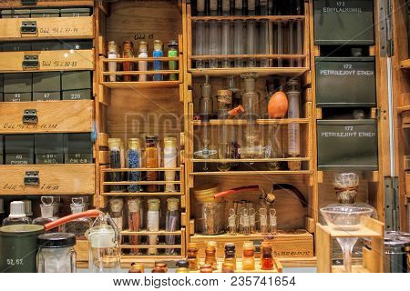 Beautiful Antique Pharmacy - Old Cupboard, Colorful Flasks, Small Boxes. Wooden Shelf